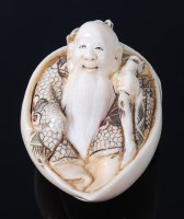 Lot 2283 - A Japanese Meiji period carved ivory netsuke,...