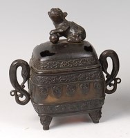 Lot 2303 - A Chinese bronze twin handled pot pourri and...