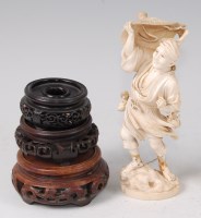 Lot 2310 - A Japanese Meiji period carved ivory okimono,...