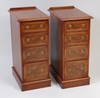 Lot 2449 - A pair of walnut four drawer bedside chests,...