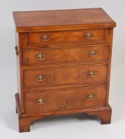 Lot 2451 - A figured walnut and crossbanded fold-over...