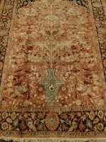 Lot 2459 - A Persian woollen peach ground carpet,...