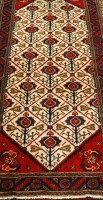 Lot 2461 - A Persian woollen Brojerd runner, the cream...