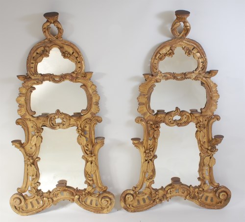 Lot 2483 - A pair of early George III giltwood pier...