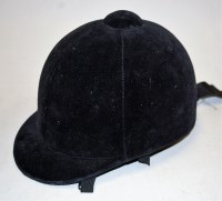 Lot 44 - A lady's brushed velvet riding hat, bearing...