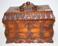 Lot 46 - A reproduction carved hardwood box and cover,...