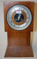 Lot 132 - An Art Deco walnut cased mantel clock, having...