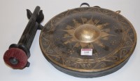 Lot 140 - An Eastern brass dinner gong with beater