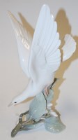 Lot 186 - A Lladro porcelain figure of a dove, printed...