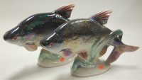 Lot 1 - A pair of lustre glazed pottery fish ornaments,...