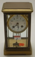 Lot 6 - An English lacquered brass cased mantel clock,...