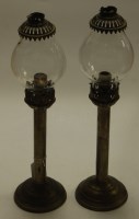 Lot 9 - A pair of metal pedestal lamps with glass...