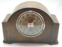 Lot 12 - An Art Deco oak cased mantel clock, with...