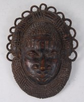 Lot 114 - A Benin bronze mask, possibly Yoruba tribe,...