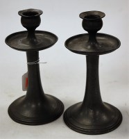 Lot 12 - A pair of Arts & Crafts hammered pewter table...
