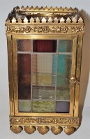 Lot 16 - An early 20th century brass framed stained and...