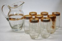 Lot 47 - A 1950s clear glass lemonade set, etched with...