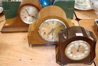 Lot 109 - A 1930s oak cased mantel clock having silvered...
