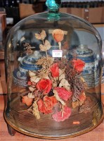 Lot 118 - A display of dried flowers under large...