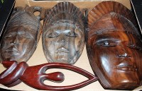 Lot 124 - Three contemporary carved rosewood tribal...