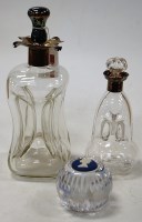 Lot 165 - An Edwardian glass decanter, of hourglass form,...