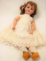 Lot 174 - An early 20th century German bisque head doll,...