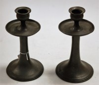 Lot 21 - A pair of Arts & Crafts hammered pewter table...