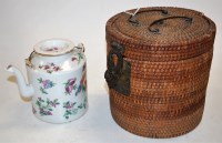 Lot 30 - A Chinese glazed stoneware teapot in wicker case
