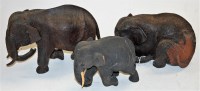 Lot 31 - Three carved and ebonised wooden elephants
