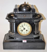 Lot 90 - A circa 1900 black slate cased mantel clock of...