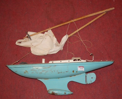 Lot 115 - A 1960s tinplate model pond yacht