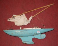 Lot 115 - A 1960s tinplate model pond yacht