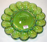 Lot 165 - A boxed iridescent lime carnival glass egg and...