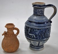 Lot 167 - A German stoneware ewer, together with a small...