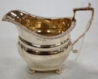 Lot 192 - An Edwardian silver cream jug by Mappin & Webb,...