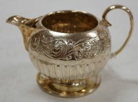 Lot 194 - A late Victorian silver and embossed cream jug,...