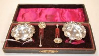 Lot 201 - A cased pair of silver table salts together...