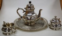 Lot 211 - A modern pewter three-piece teaset on tray