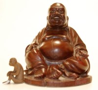 Lot 231 - A small Yixing(?) figure of a monkey in seated...