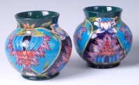 Lot 22 - A pair of Moorcroft pottery vases in the...