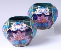 Lot 28 - A pair of Moorcroft pottery vases in the...