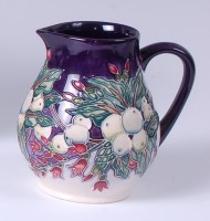 Lot 31 - A Moorcroft pottery jug in the Snowberry...