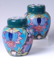Lot 38 - A pair of Moorcroft pottery ginger jars in the...