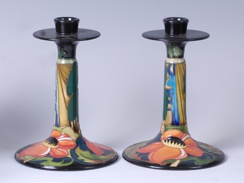 Lot 39 - A pair of Moorcroft pottery candlesticks in...