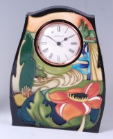 Lot 47 - A Moorcroft pottery clock in the Ryden Fields...