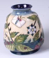 Lot 51 - A Moorcroft pottery vase in the Festive Garden...