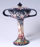 Lot 75 - A Moorcroft pottery bonbonnière and cover in...