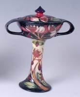 Lot 77 - A Moorcroft pottery bonbonnière and cover in...