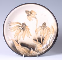 Lot 82 - A Moorcroft pottery plate in the Cone Flower...