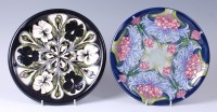 Lot 88 - A Moorcroft pottery plate in the Florian Lilac...